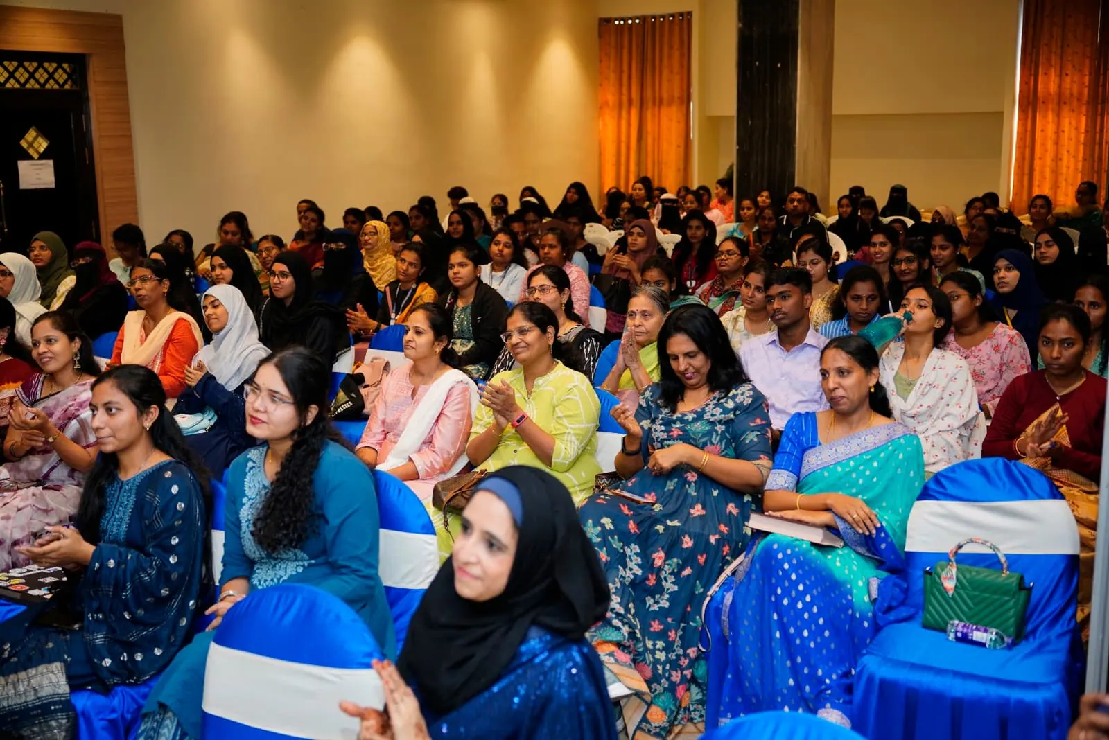 A full auditorium of health professionals at HolistiCon 2024
