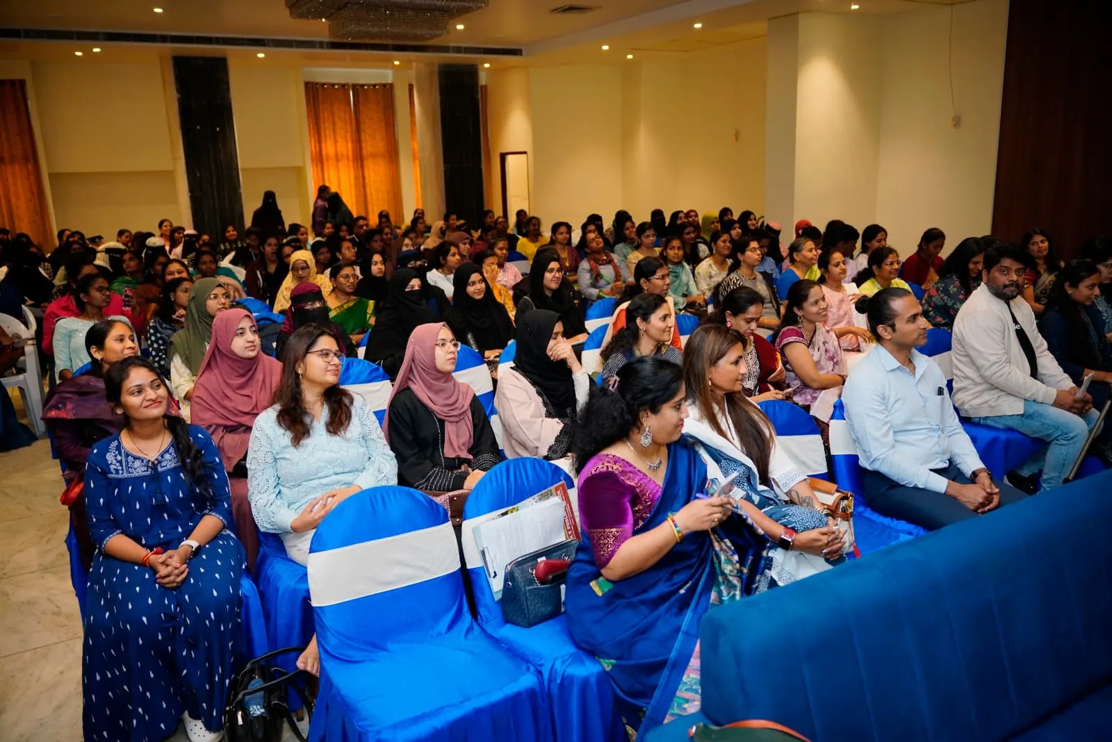 A wide view of the HolistiCon 2024 audience