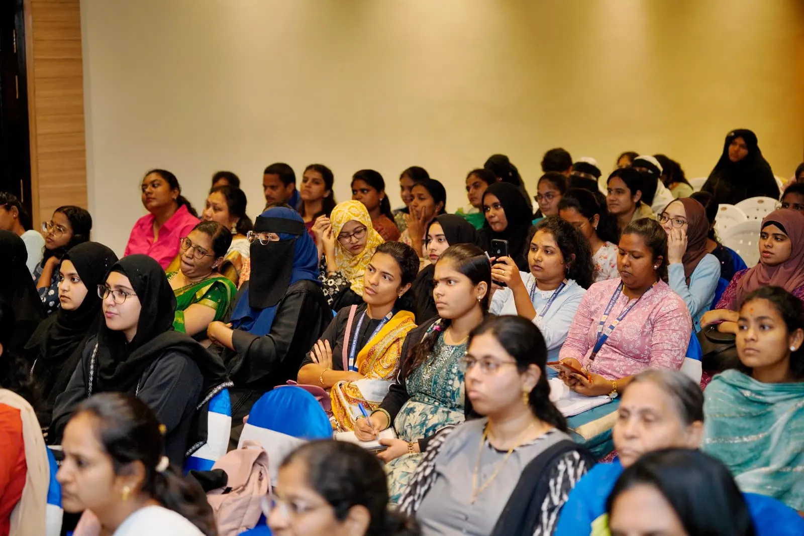 Health professionals seated through a HolistiCon 2024 session