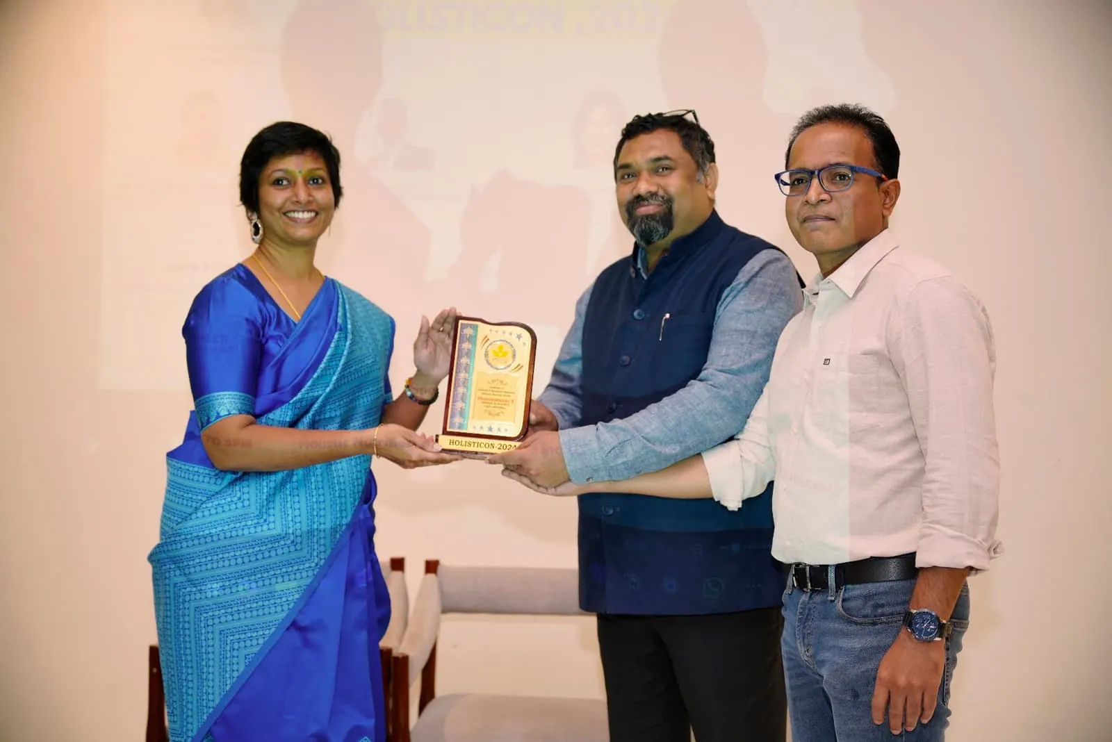 A coach receiving a plaque at HolistiCon 2024