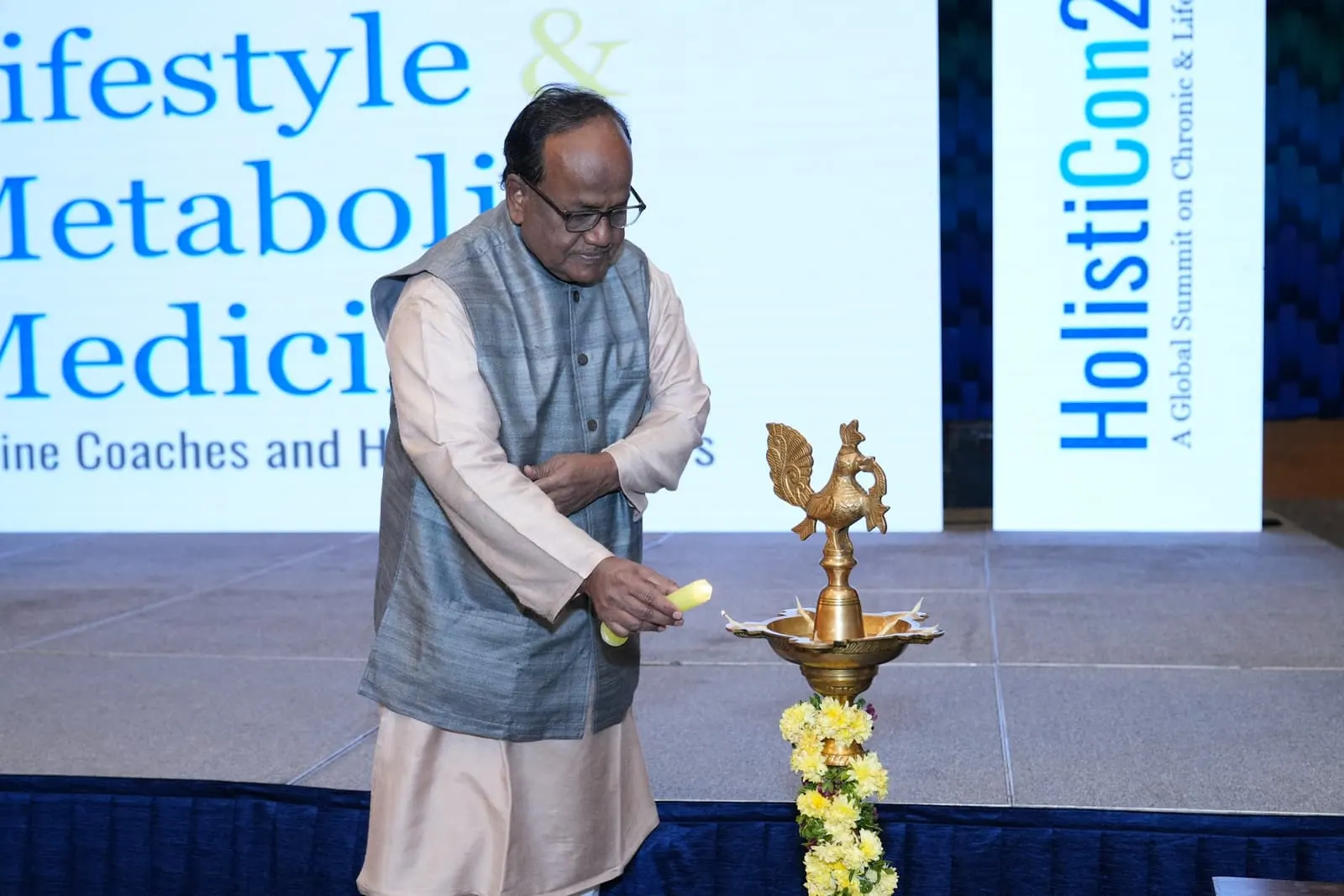 The ceremonial lamp being lit to open HolistiCon 2025