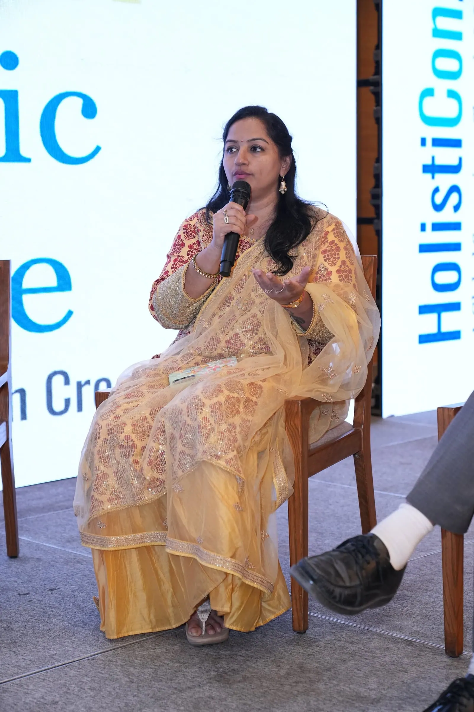 A panellist speaking during the HolistiCon 2025 discussion